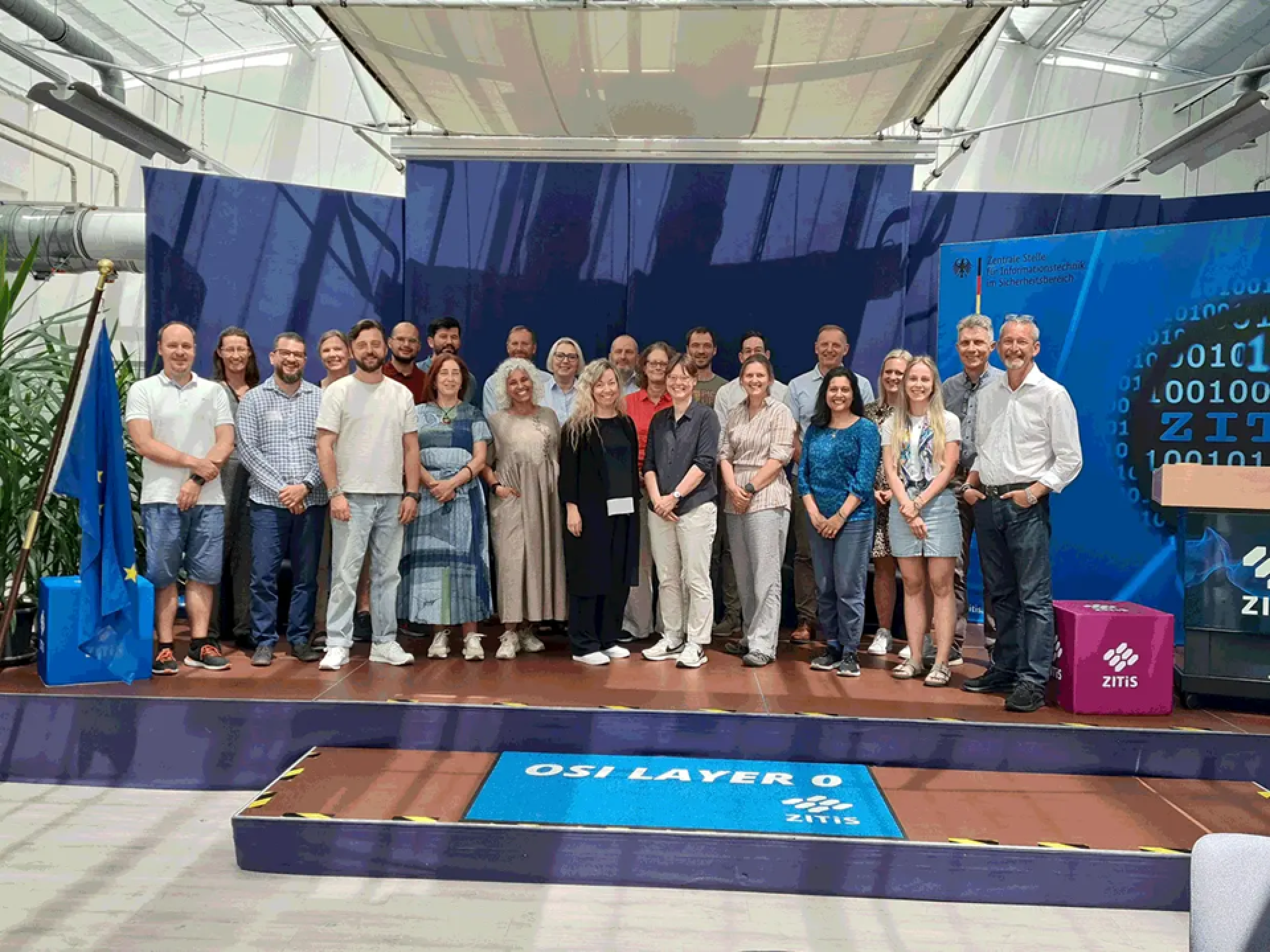 Group of forensic practitioners standing on a stage