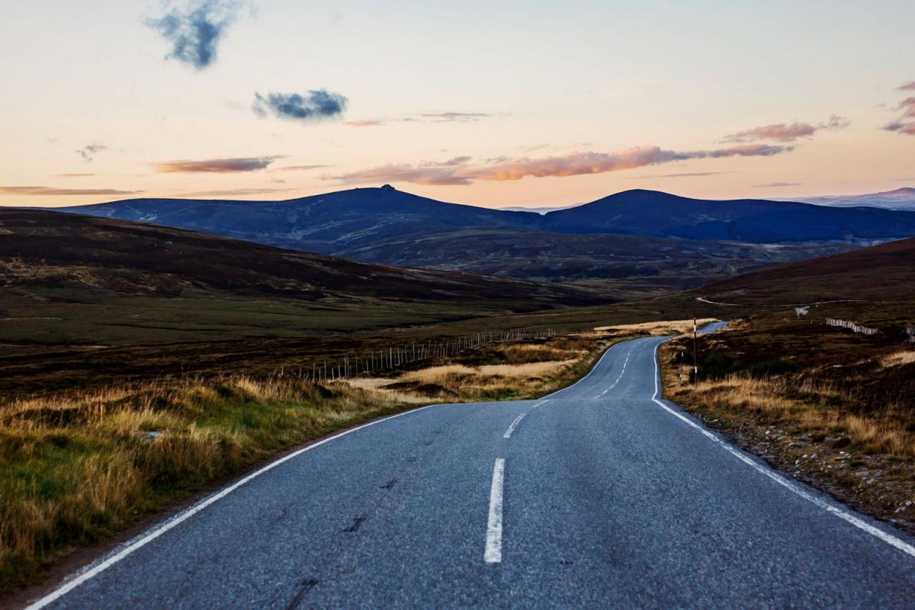 Photo of an open road in Scotland